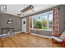 A room with a fireplace and a chair.