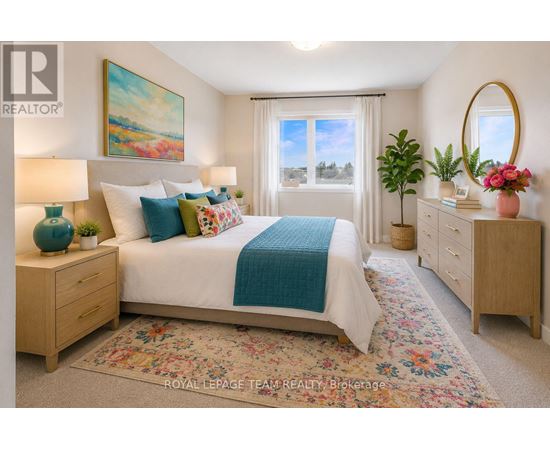 A bedroom with a large bed, a painting on the wall, and a window with a view of trees.