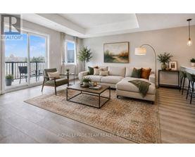 A well-lit living room with a sofa, chairs, and a rug.
