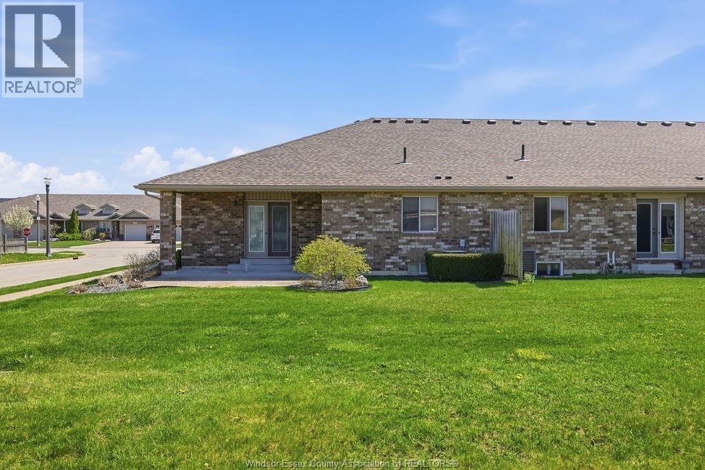 A house with a lawn in front of it.