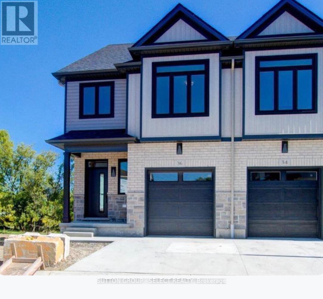 A modern two-story house with a garage is for sale.