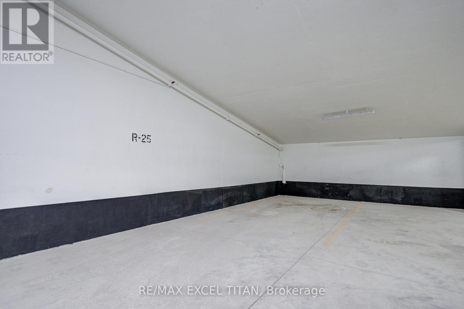 A white room with a black line on the wall and a yellow line on the floor.