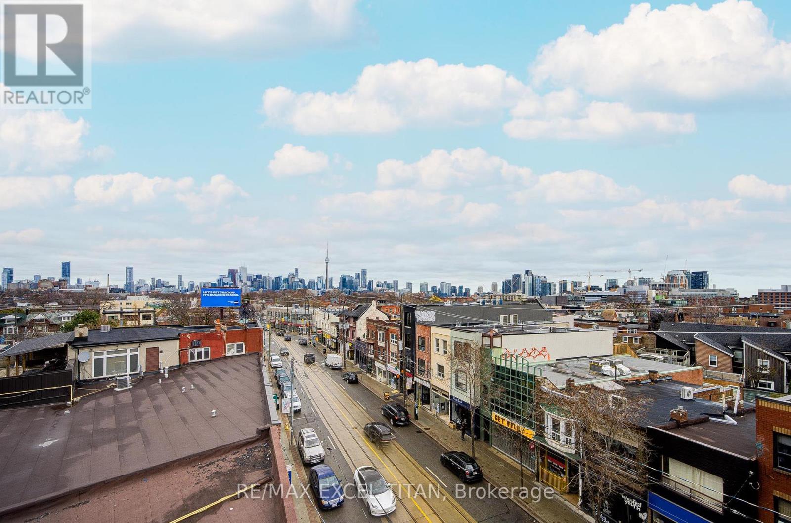 A city street with cars and buildings.