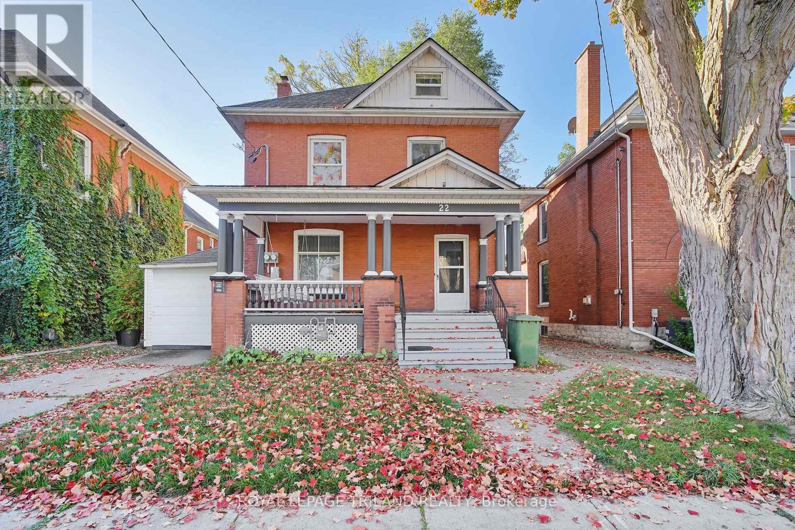 A house with a red brick exterior and a white door.