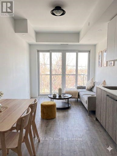 A modern living room with a dining table and a sofa.