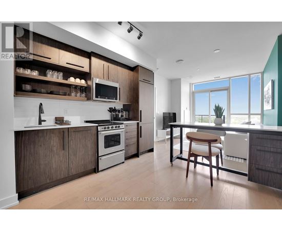 A modern kitchen with wood cabinets and stainless steel appliances.