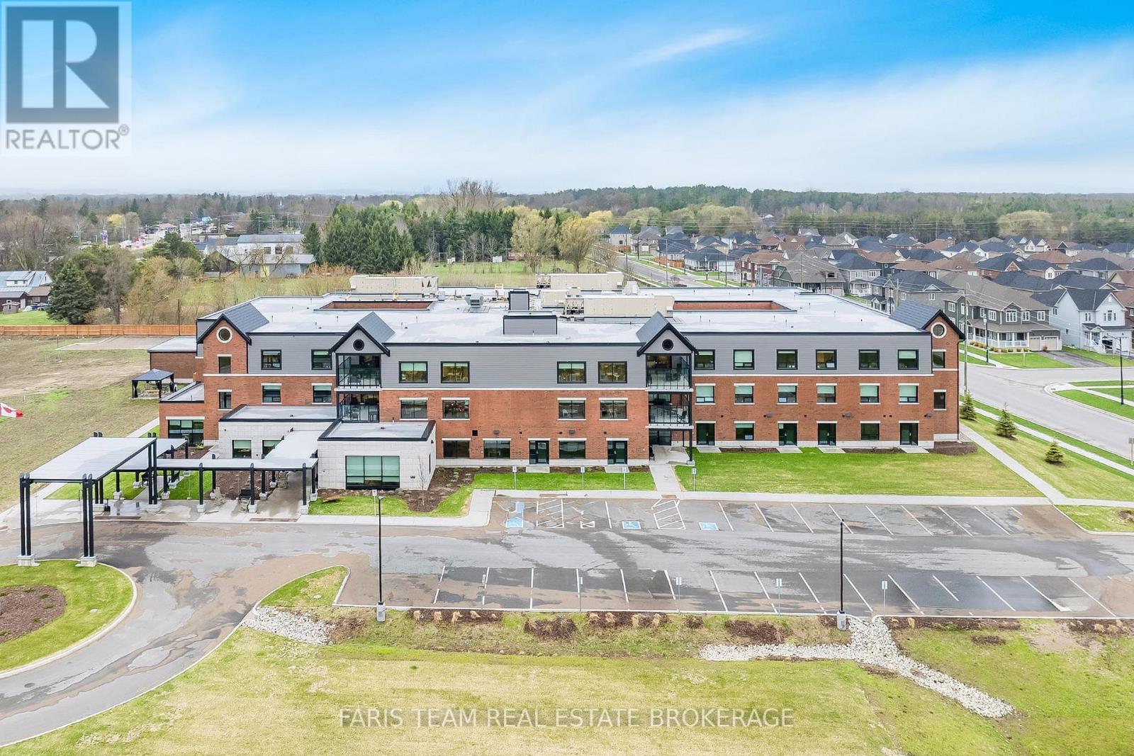 A large building with a parking lot in front of it.
