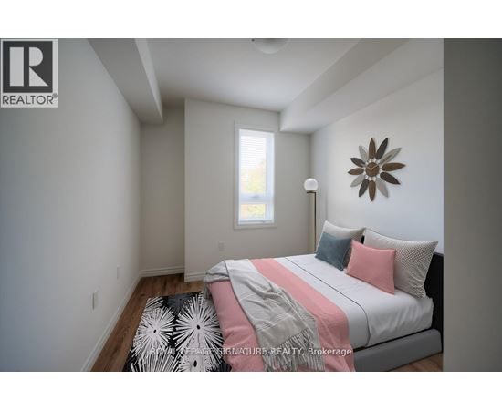 A bedroom with a bed, pillows, and a ceiling fan.