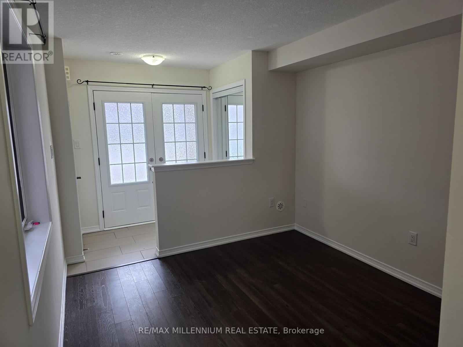 A room with a door and a window.