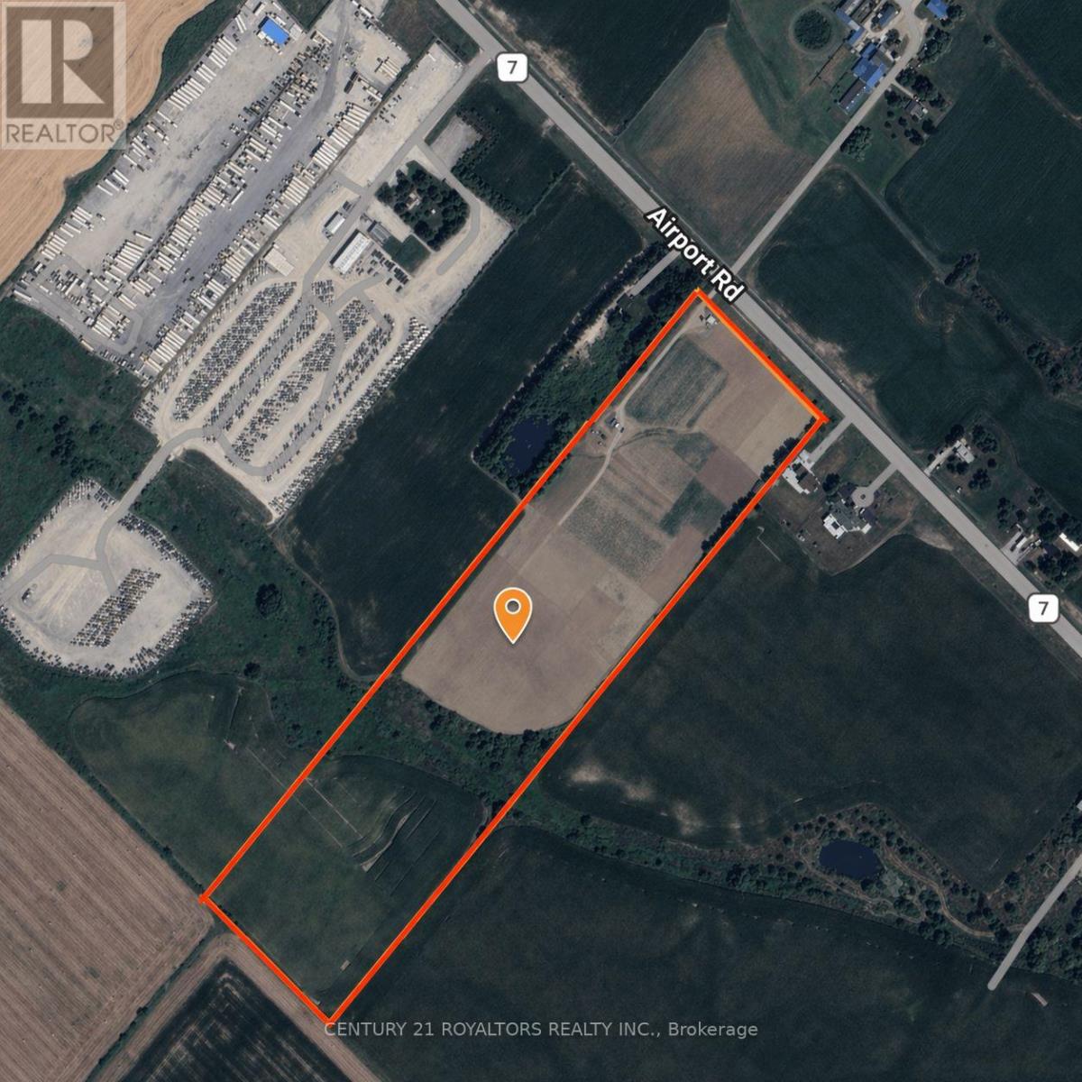An aerial view of a property with a large orange rectangle outlined.