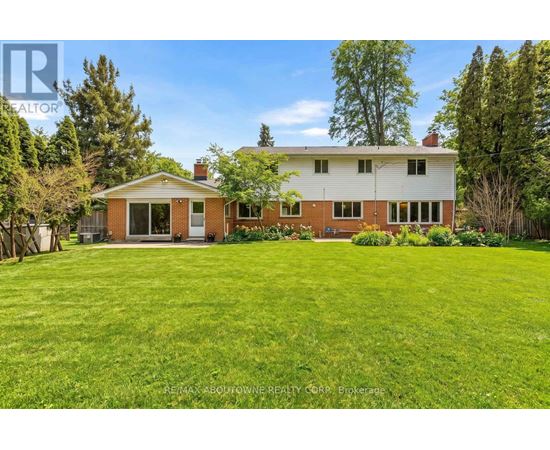 A house with a lawn in front of it.