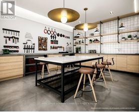 A kitchen with a table and chairs in the middle of it.