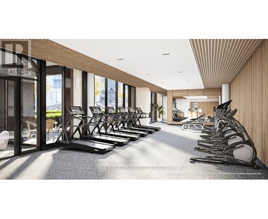 A gym with treadmills and a sign that says "REALTOR".