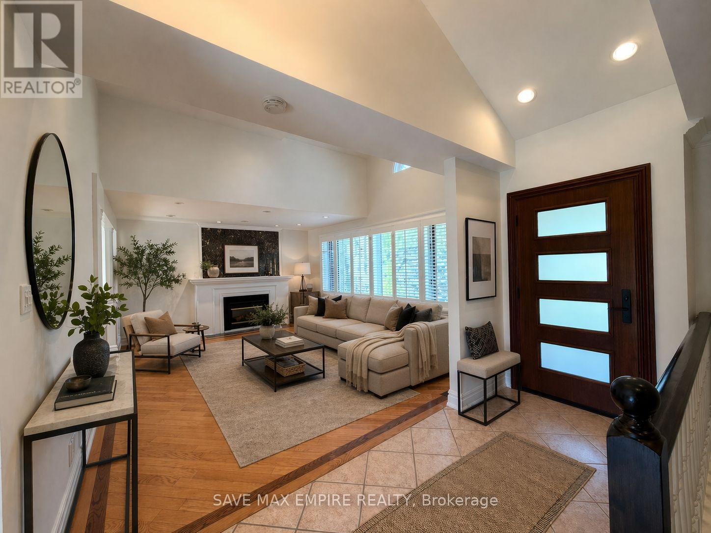 A living room with a fireplace and a couch.