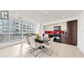 A modern kitchen with a glass table and chairs.