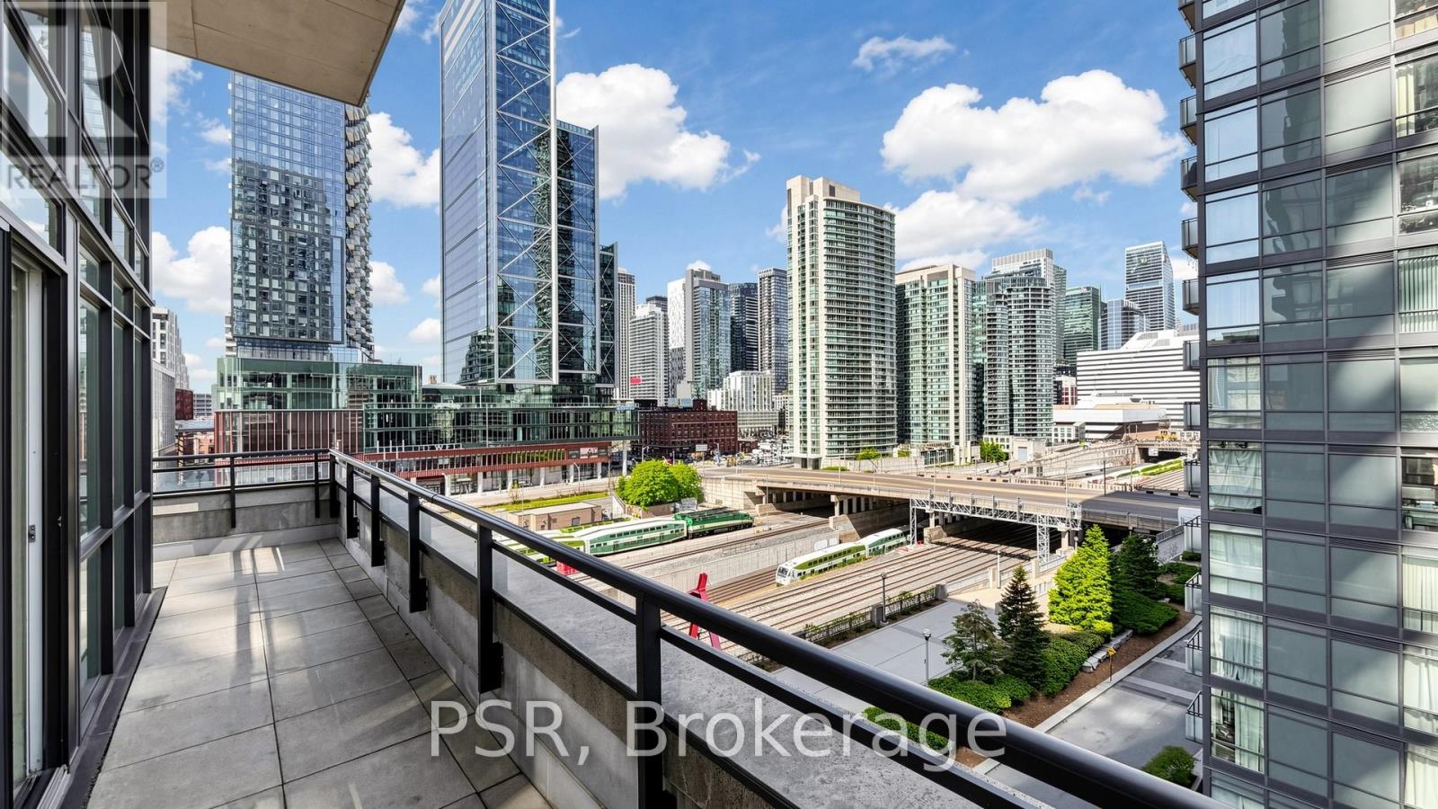 A cityscape with tall buildings and a clear sky.