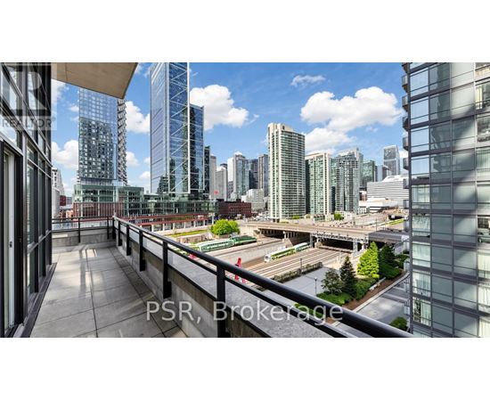 A cityscape with tall buildings and a clear sky.