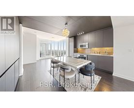 A modern kitchen with a dining table and chairs.