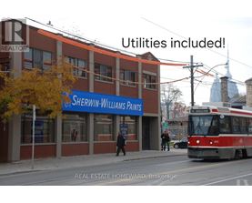 A street view with a building named Sherwin-Williams Paints.