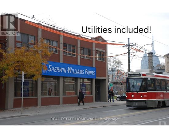 A street view with a building named Sherwin-Williams Paints.