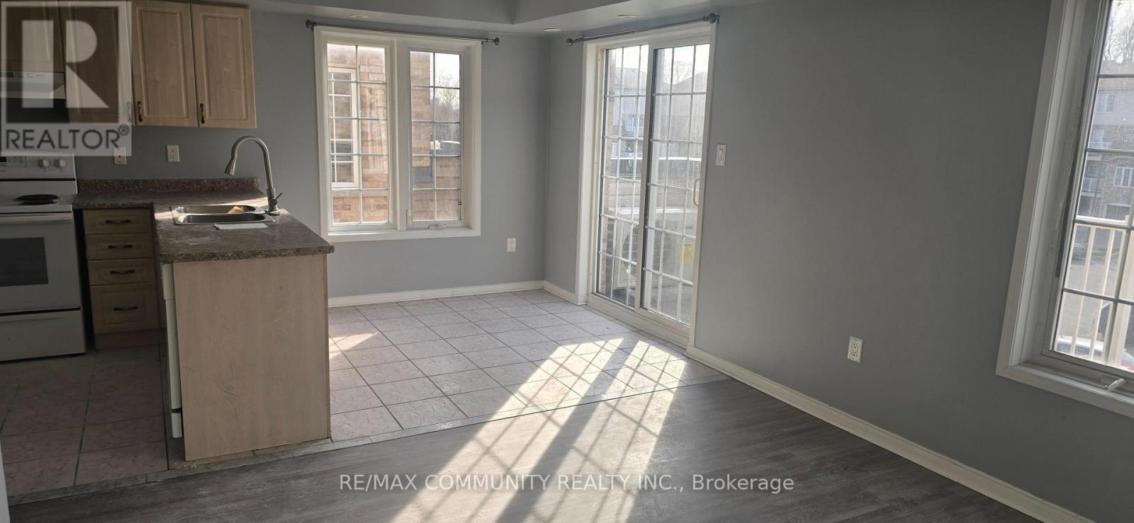 A kitchen with a sink and a window.