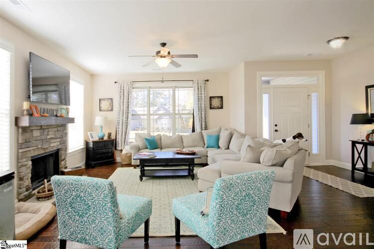 A living room with a fireplace and a couch.
