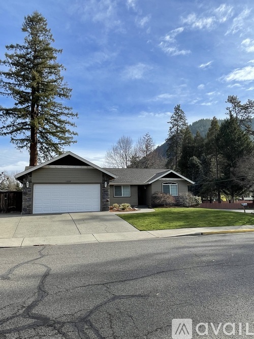 A house with a driveway in front of it.