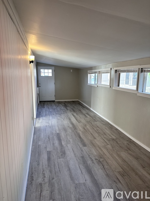 A room with grey flooring and white walls.