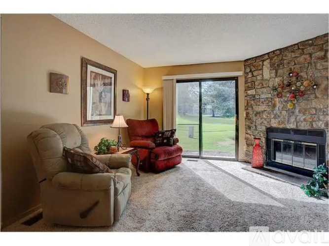 A living room with a fireplace and a couch.