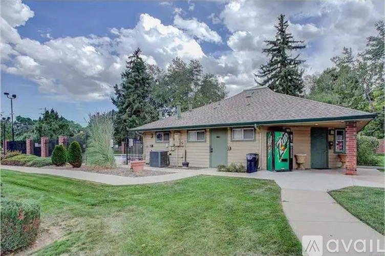 A building with a green door and a sign that says "available" in front of it.
