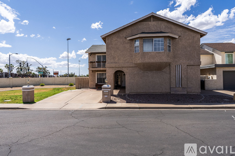 A house with a brown exterior is available for sale.