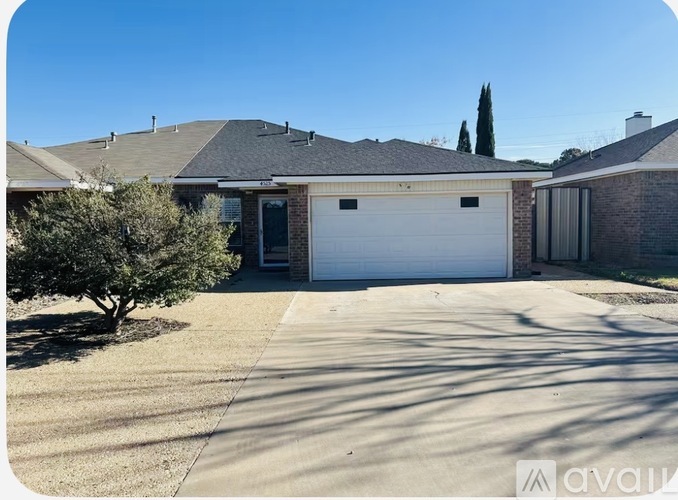 A house with a garage door is for sale.