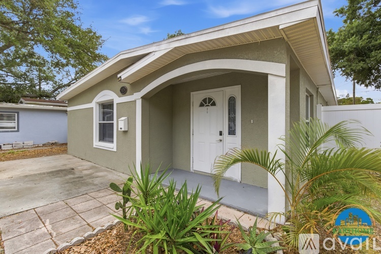 A house with a white door and windows is for sale.