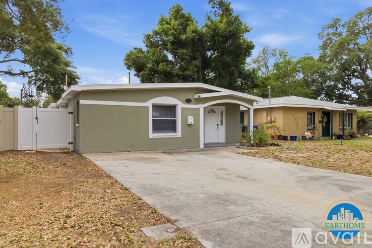A house with a driveway in front of it is for sale.