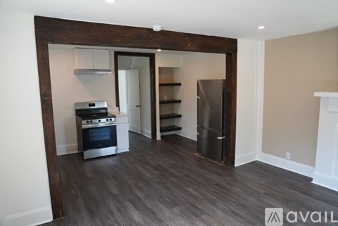 A kitchen area with a stove and a refrigerator.