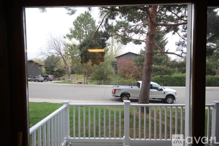 A white picket fence in front of a house.