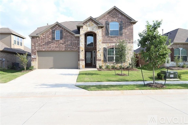 A house with a driveway in front of it.