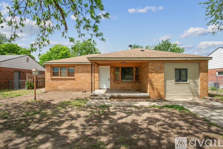 A house with a front yard is for sale.