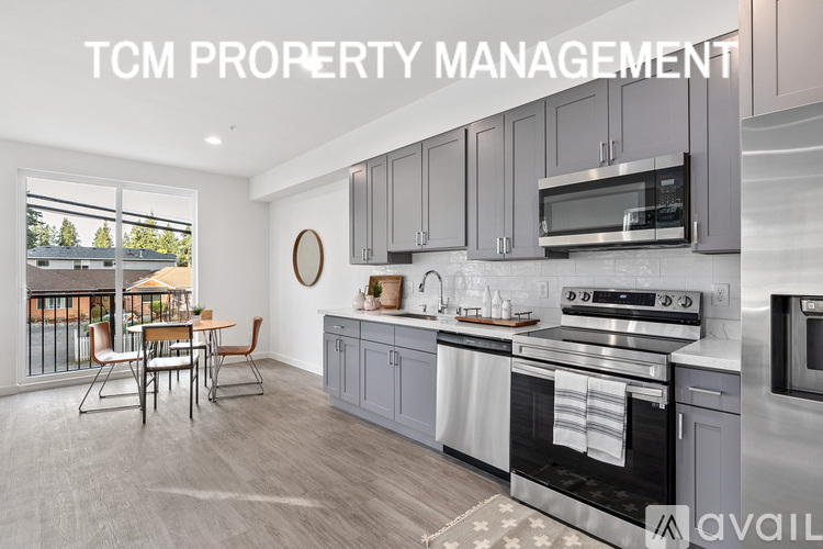 A modern kitchen with the words TCM PROPERTY MANAGEMENT over it.
