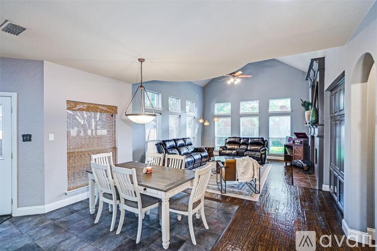 A dining room with a table and chairs is shown.