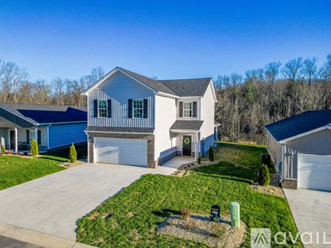 A house with a garage is for sale.