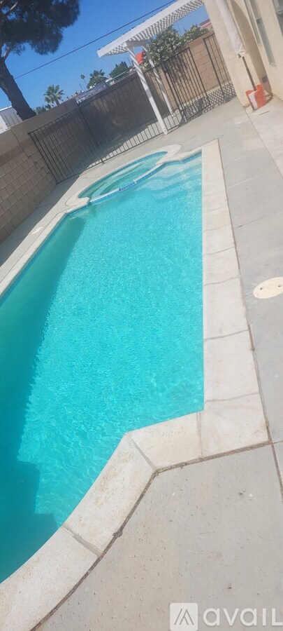 A small pool with a white border and a white tile edge.