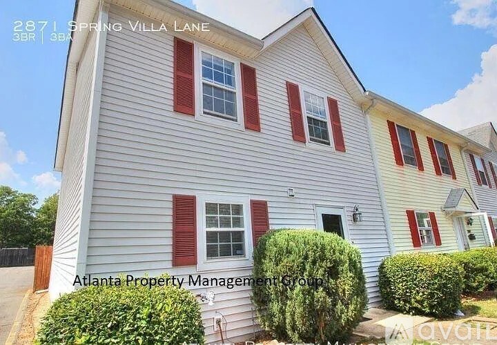 A two-story house with red shutters is for sale at 2871 Spring Villa Lane.