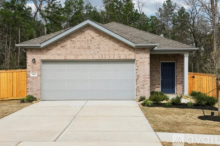 A house with a garage door and a blue door.