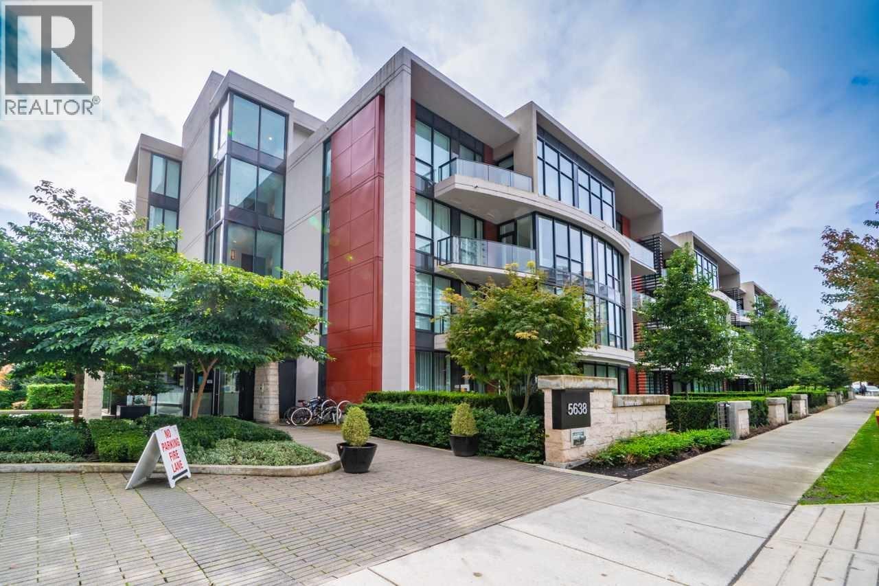 A modern building with a red door and a sign that says "For Rent".