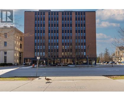 A building with a sign that says REALTOR in the upper left corner.
