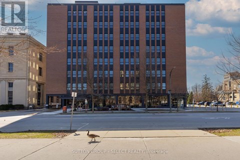 A building with a sign that says REALTOR in the upper left corner.