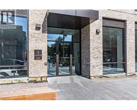 The front of a building with a glass door and a sign that says "REALTOR".