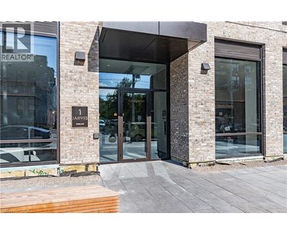 The front of a building with a glass door and a sign that says "REALTOR".