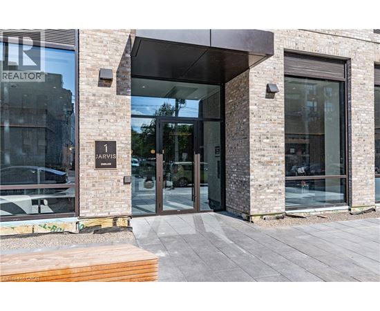 The front of a building with a glass door and a sign that says "REALTOR".